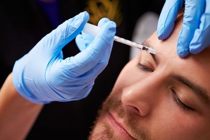 Man Having Botox Treatment At Beauty Clinic